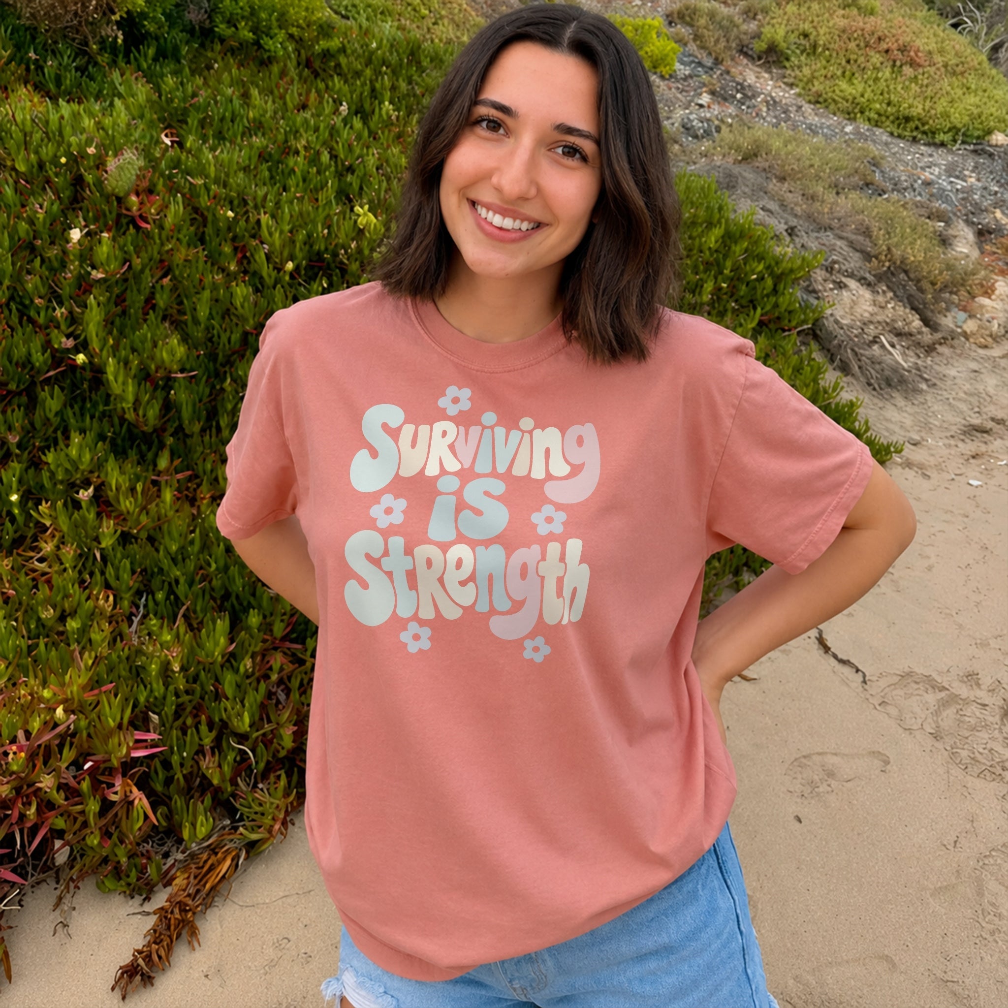 Surviving Is Strength Tee - Coral front