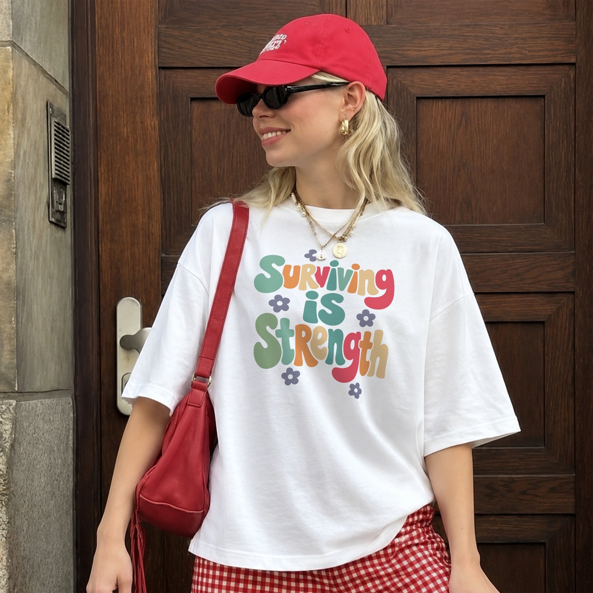 Surviving Is Strength Tee - White front
